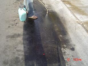 Application of enviornmentally friendly concrete brightening agent. (can also be used on asphalt) 